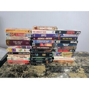 Mixed lot of approximately 30 VHS movies.Includes action, drama, and classic...